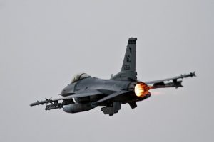 Color photograph of F-16 fighter plane taking off from Atlantic City International Airport.