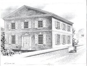 A rectangular, colonial-style brick building with many shuttered windows. A brick sidewalk lined by a short brick fence lines the right forefront of image.