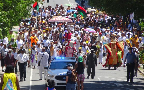 color photo of ODUNDE festival celebrants moving west on South Street to present offerings at the Schuylkill River.