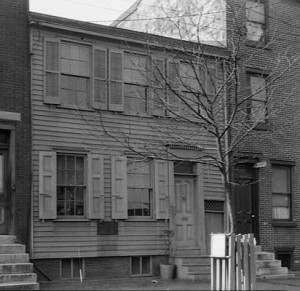 A black and white photograph of Walt Whitman's house in Camden, New Jersey.